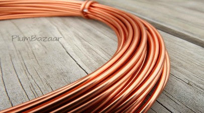 Wire, anodized aluminum, orange copper, 2mm round, 12 gauge. Sold per pkg  of 45 feet. - Fire Mountain Gems and Beads
